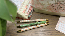 Load image into Gallery viewer, Three decorative pens on a wooden surface with Selah sticky notes and bible tab items in the background