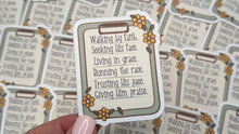 Load image into Gallery viewer, A hand with light pink manicured nails holds a small decorative Bible verse card in front of a scattered pile of identical cards.