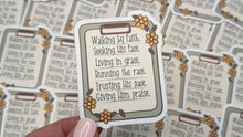 Load image into Gallery viewer, A hand with light pink manicured nails holds a small decorative Bible verse card in front of a scattered pile of identical cards.